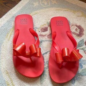 Saks flip flops with bows